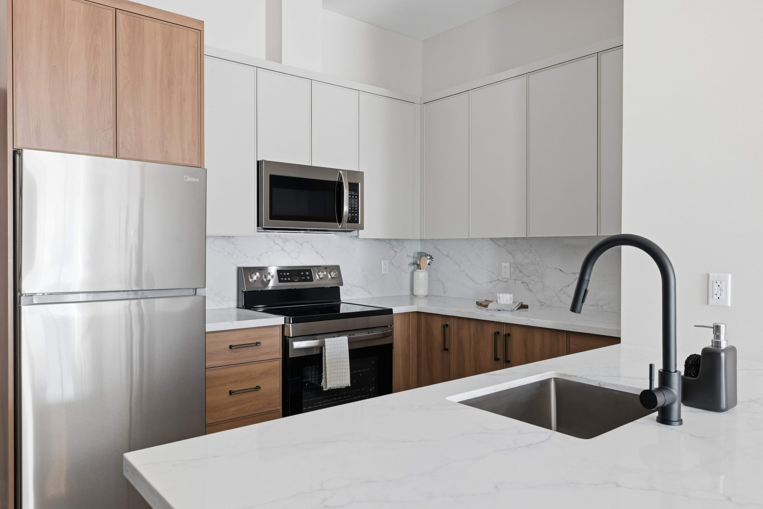Suite kitchen with stainless steel appliances