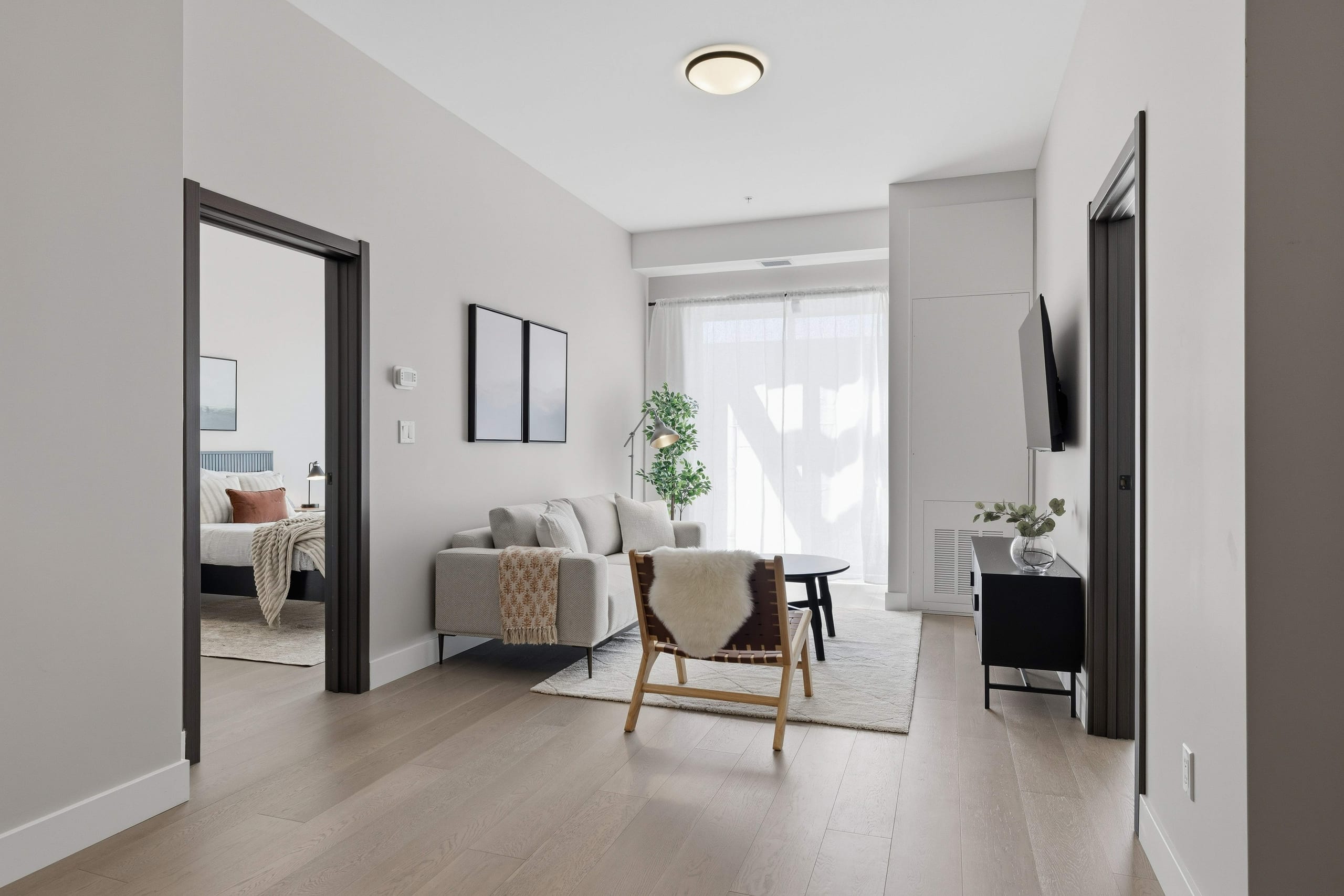 Living room with view into bedroom