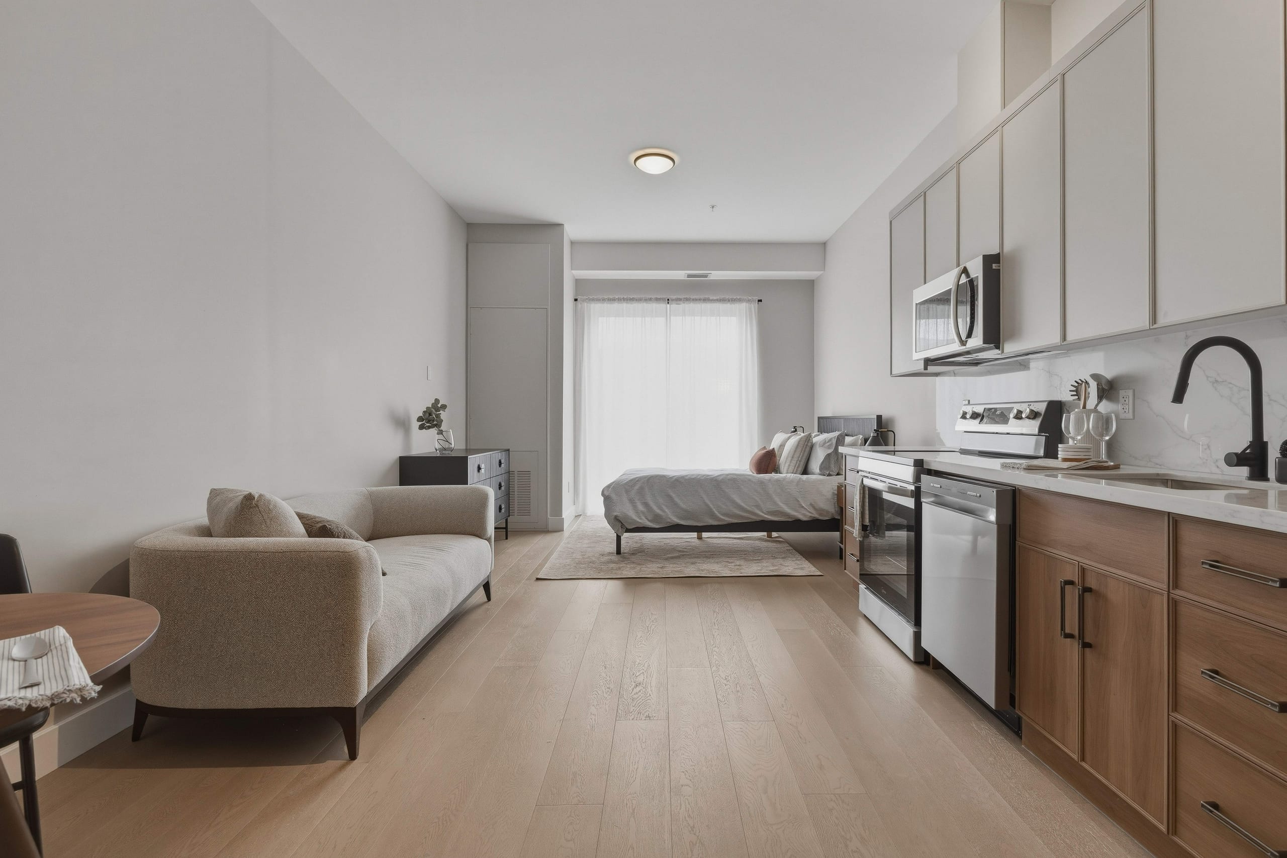 Living room with bedroom and kitchen sightline