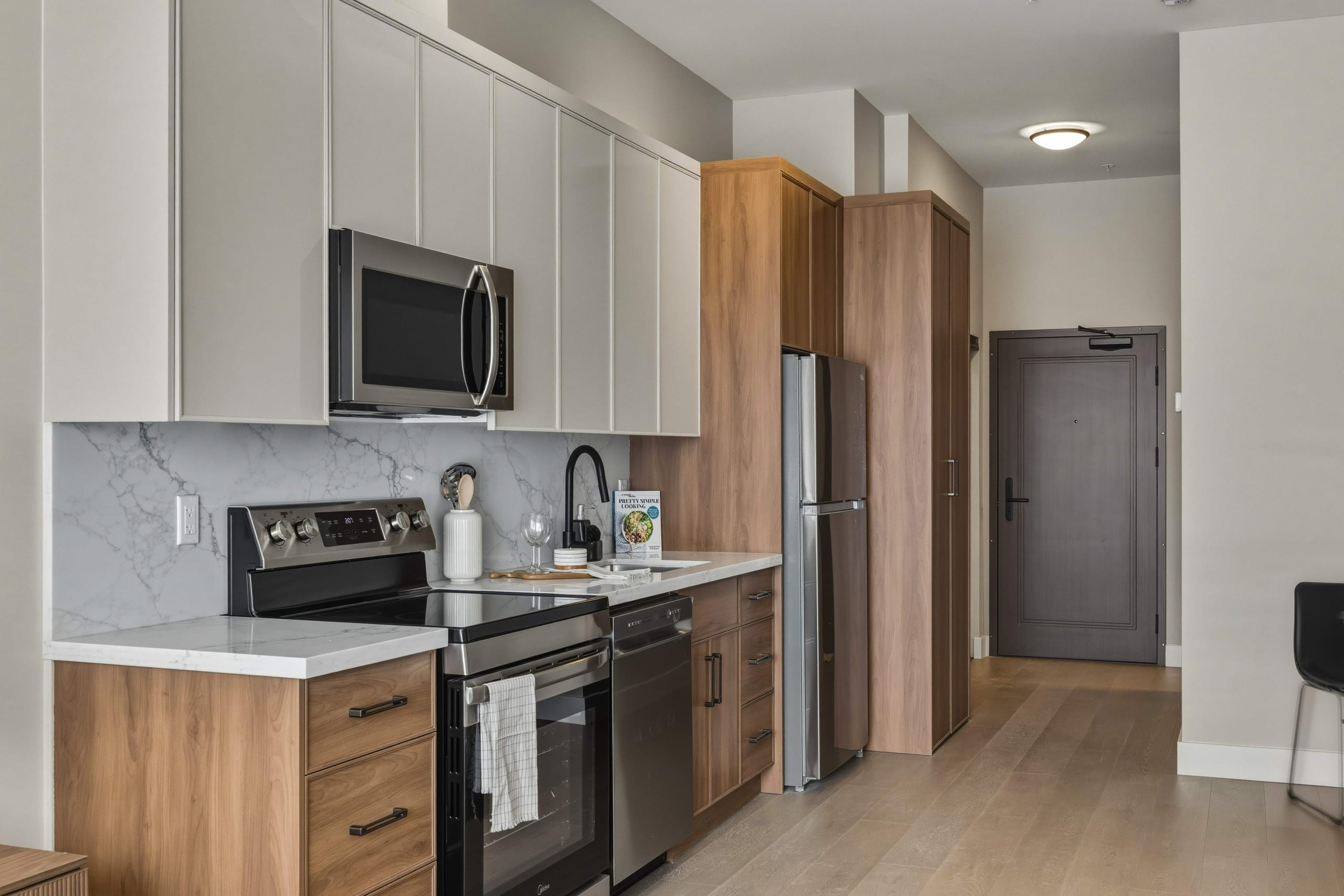 Kitchen with fridge and entry hallway