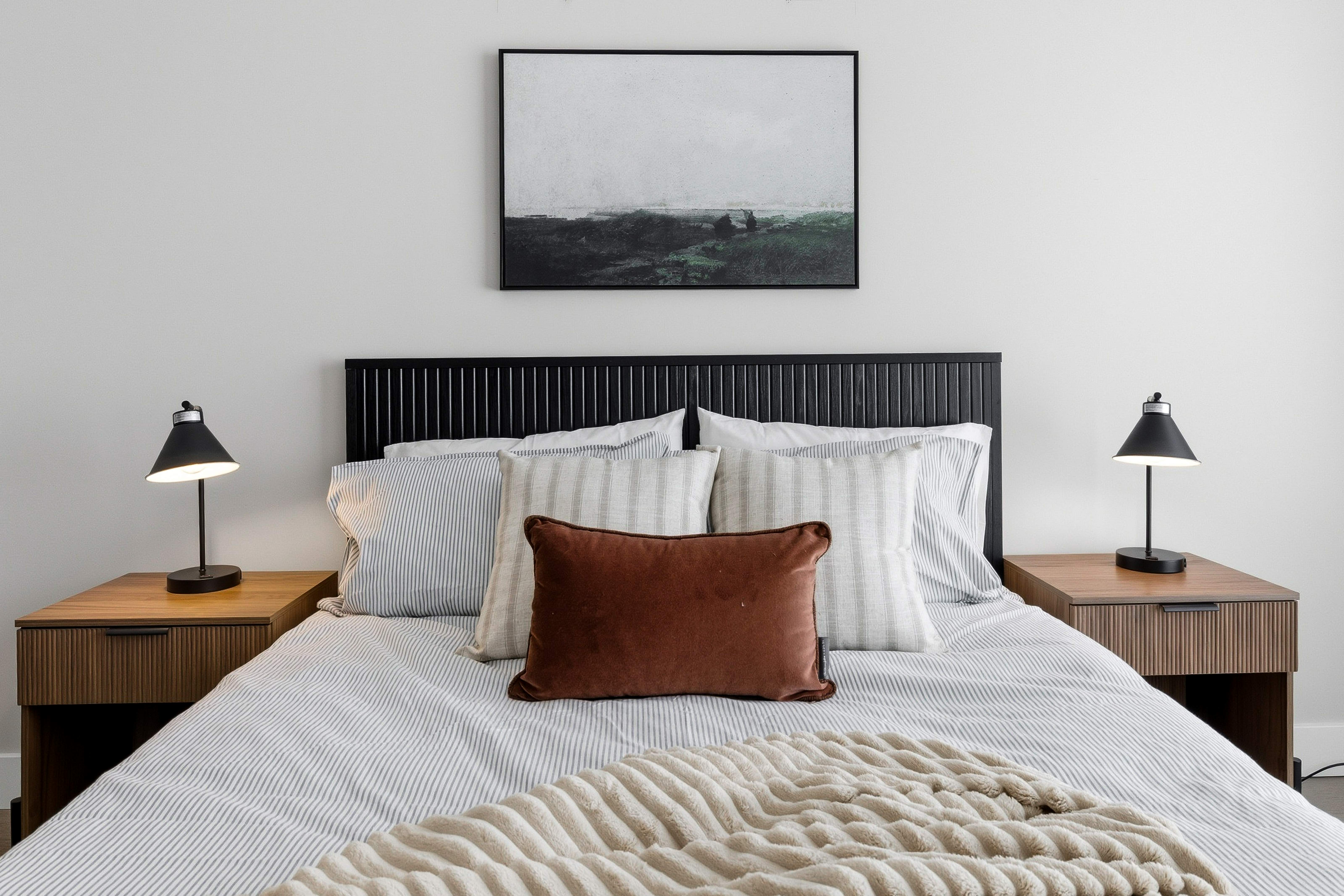 Santé Apartments — Boutique bedroom with custom millwork